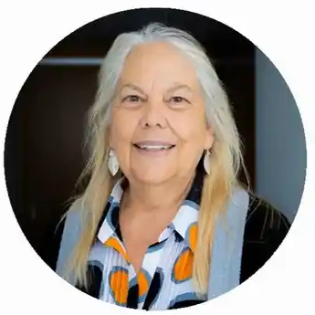 Smiling woman with long hair and earrings